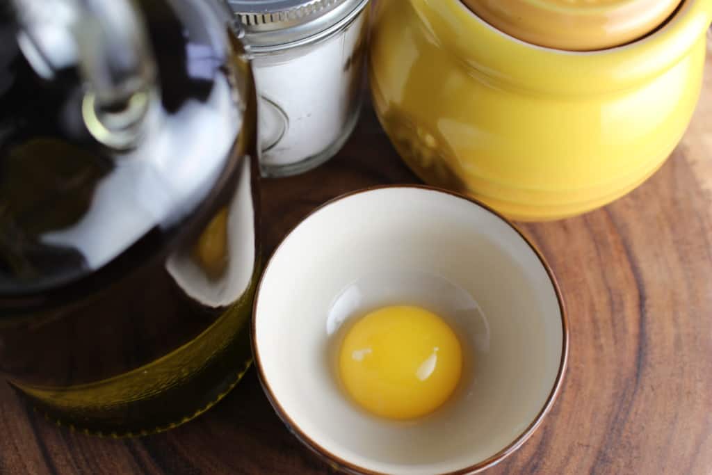 A single egg yolk in a small bowl.