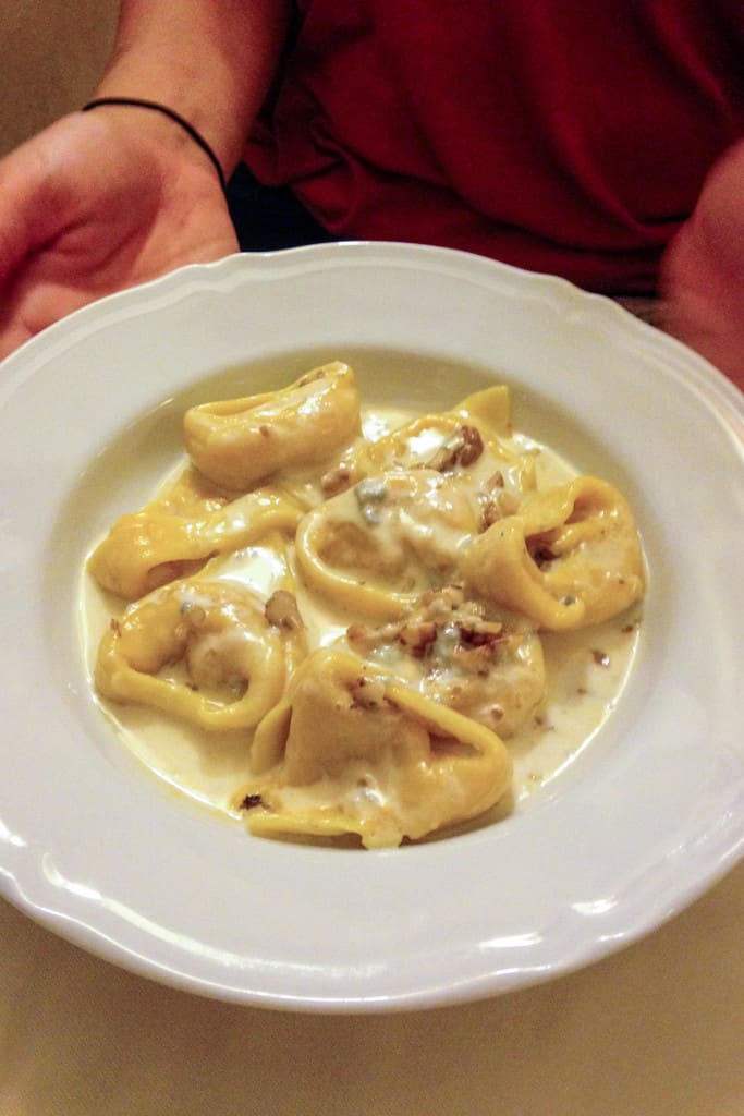 tortelloni in gorgonzola walnut cream sauce in Bologna, Italy