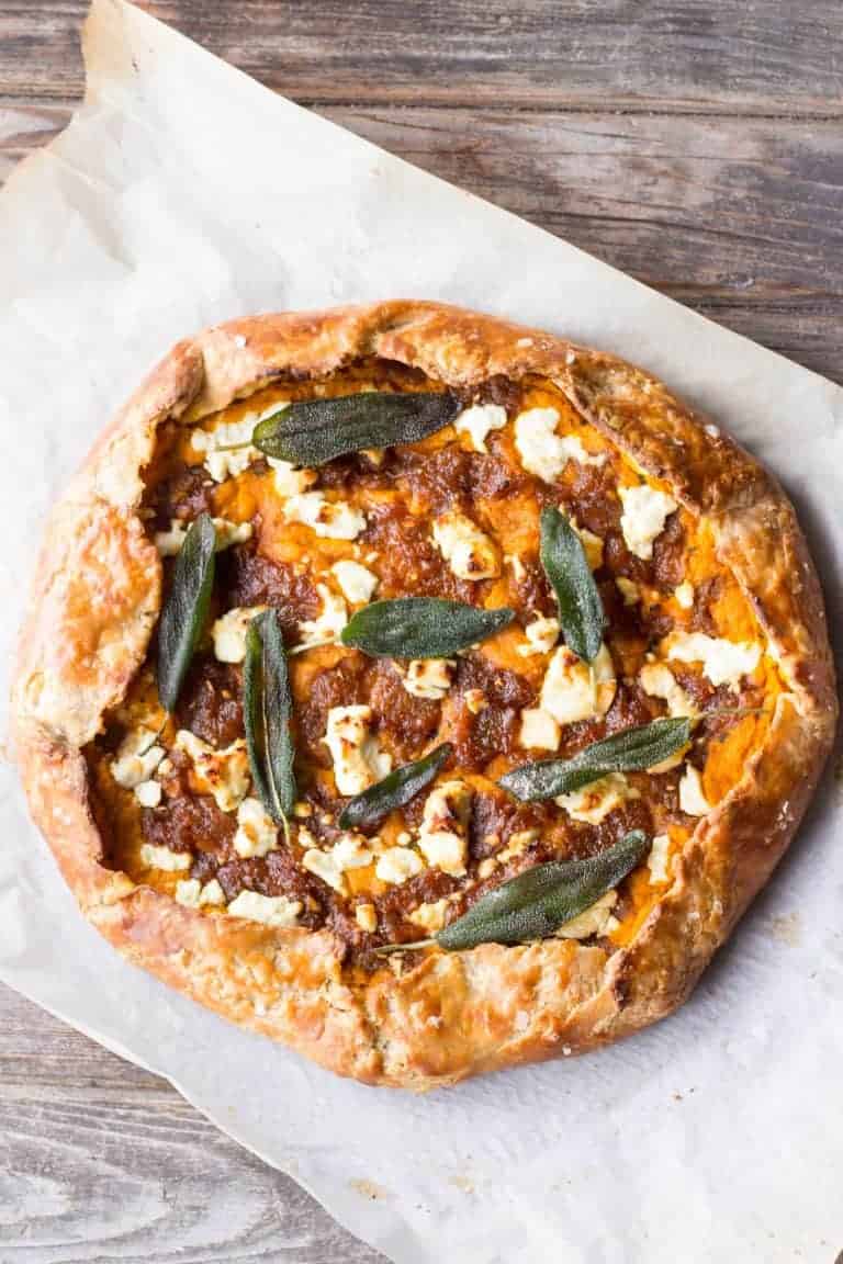 A baked galette topped with caramelized onions, goat cheese and sage.