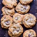 Top view close up of chocolate chunk cookies on a wood table.