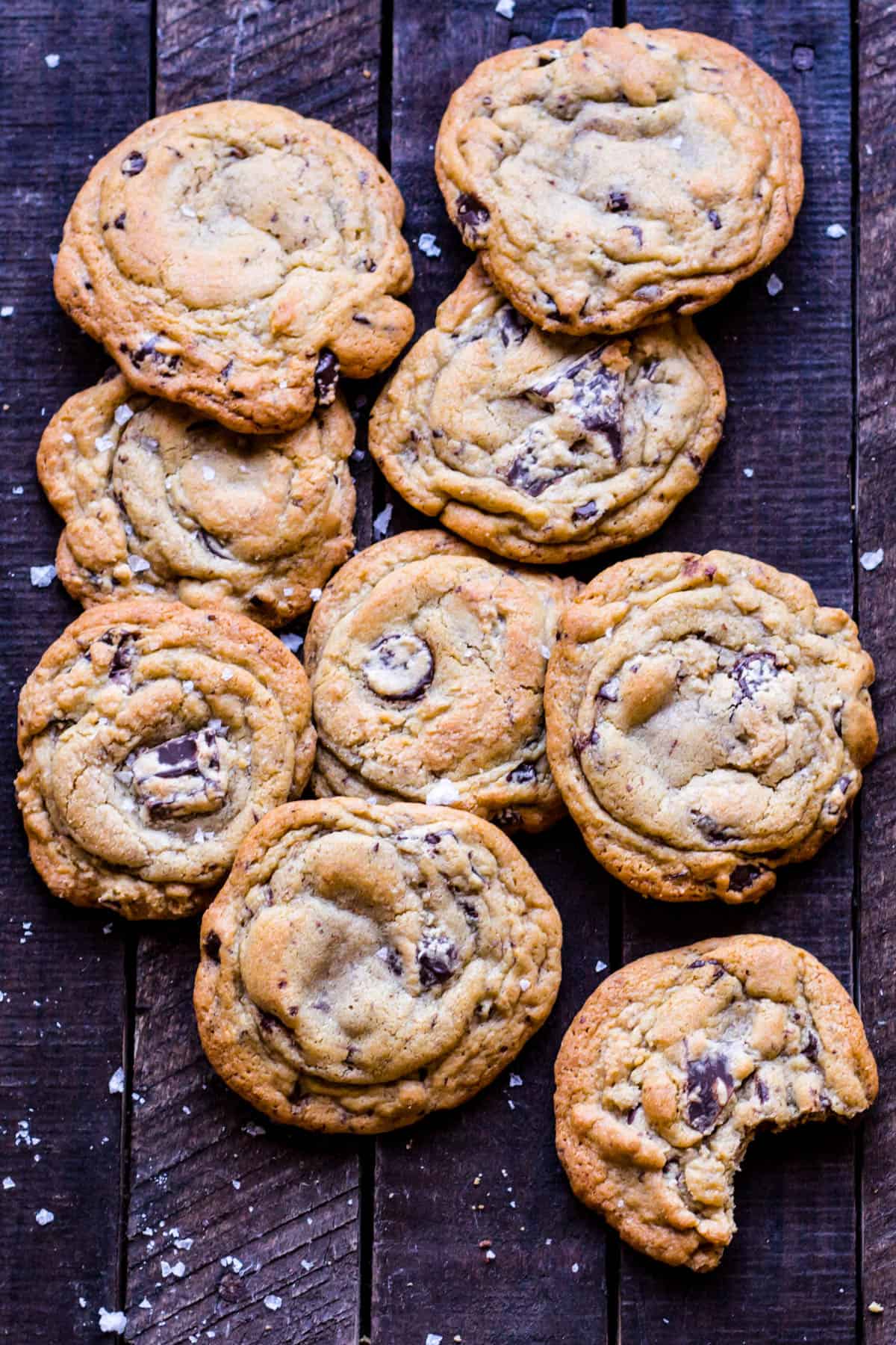 Top view close up of chocolate chunk cookies on a wood table.