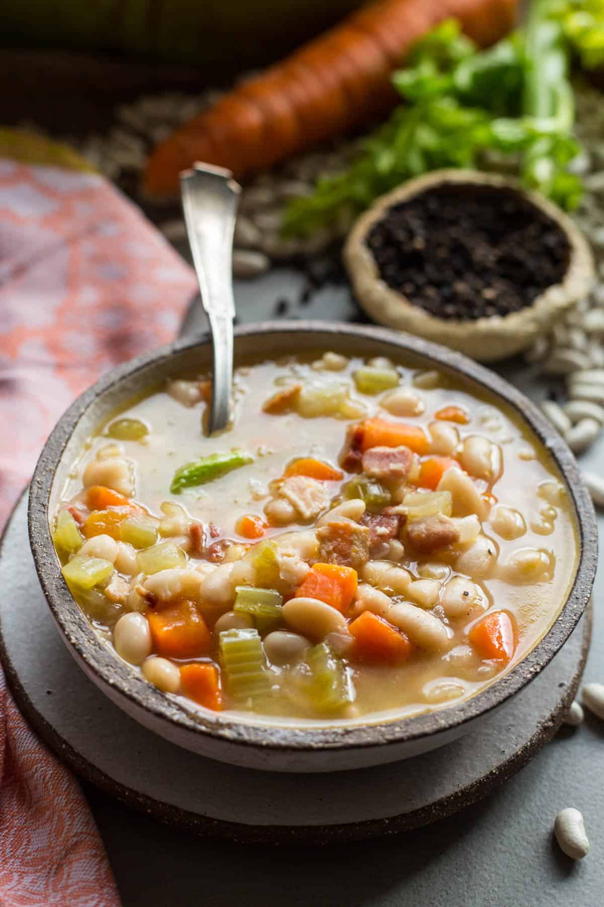 bowl of bean soup with a spoon sticking out