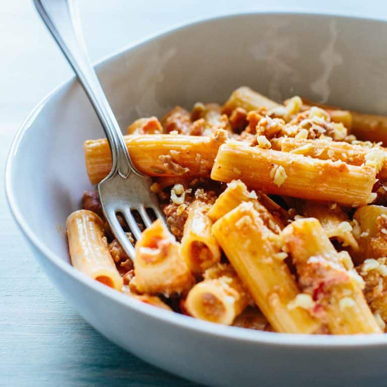 bowl of rigatoni pasta with a fork