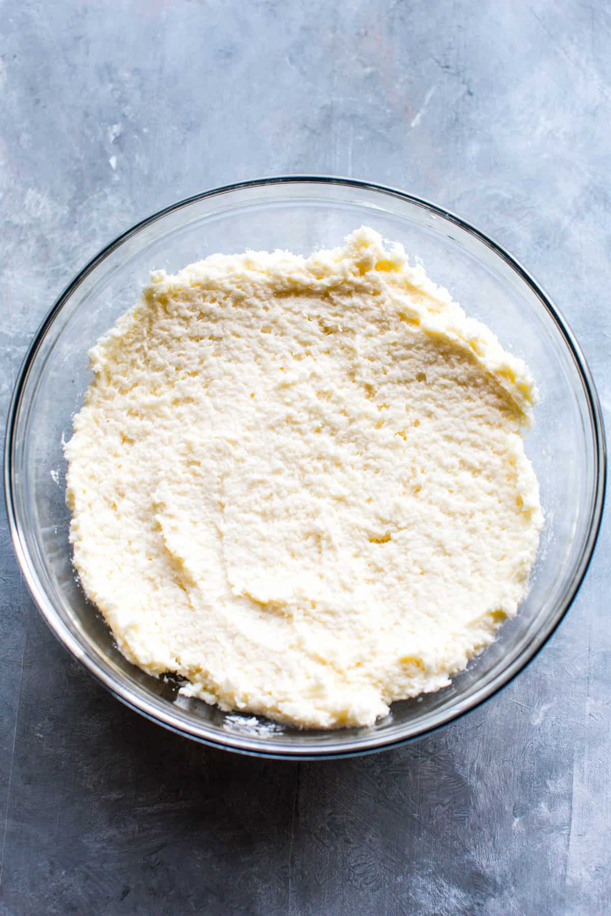 A bowl of the coconut cream cheese mixture.