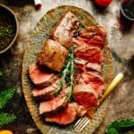 Overhead shot of a platter of sliced beef tenderloin.