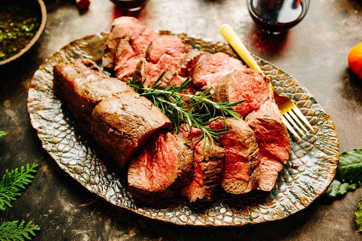 A platter with a sliced loin.