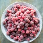 Overhead shot of a bowl of sugared cranberries.