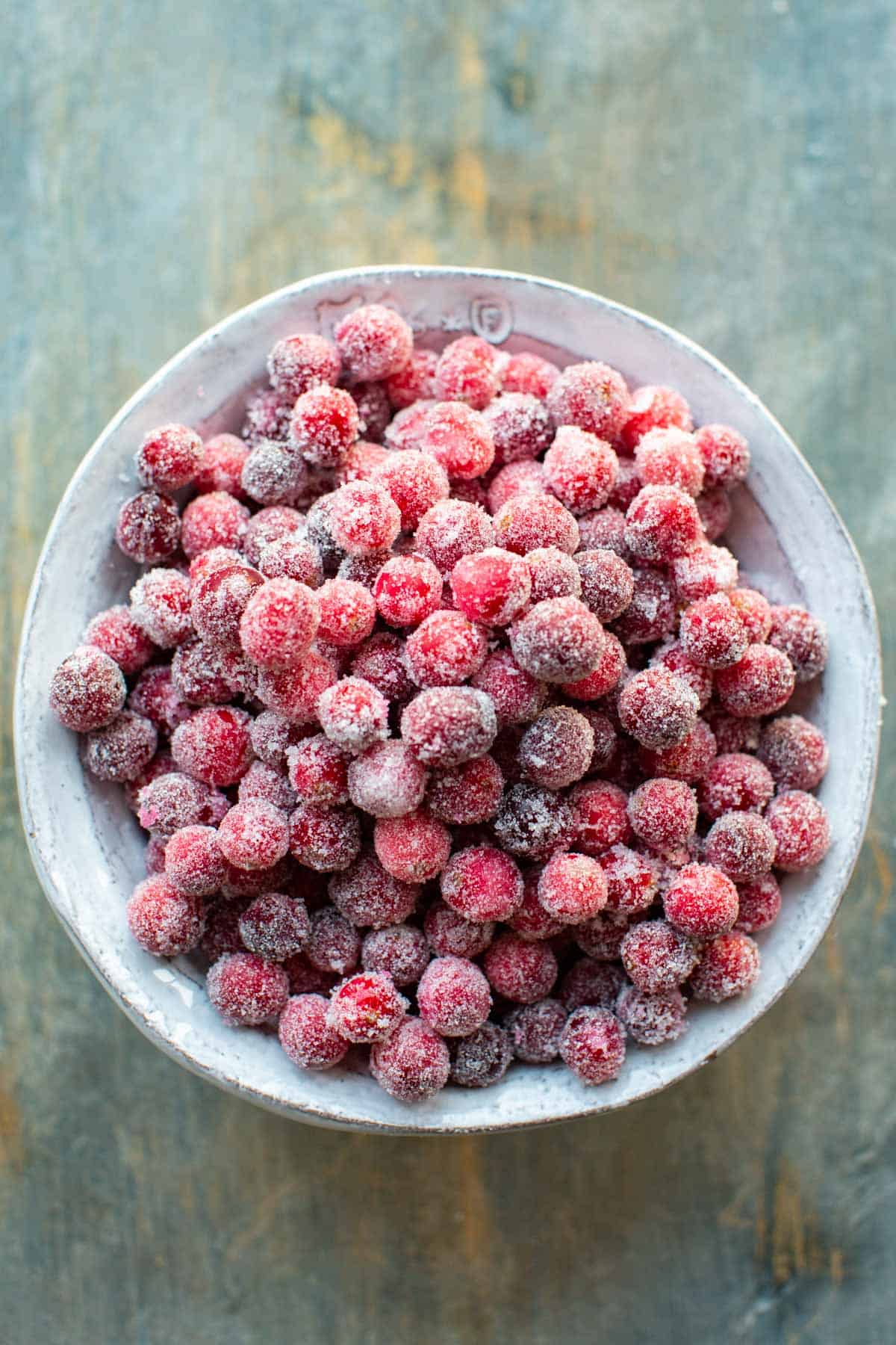 Overhead shot of a bowl of sugared cranberries.