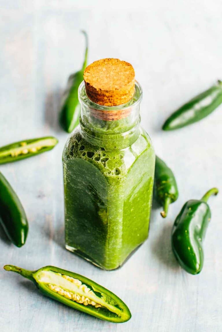 A corked bottle of jalapeño hot sauce.