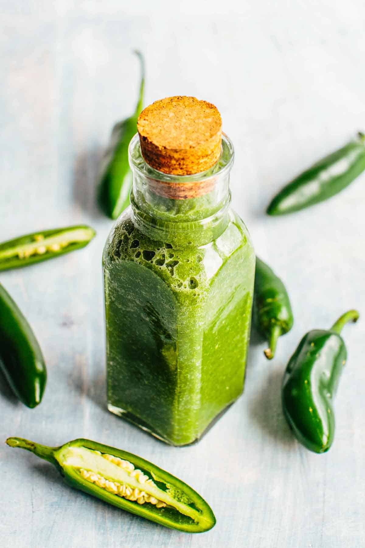 A corked bottle of jalapeño hot sauce.