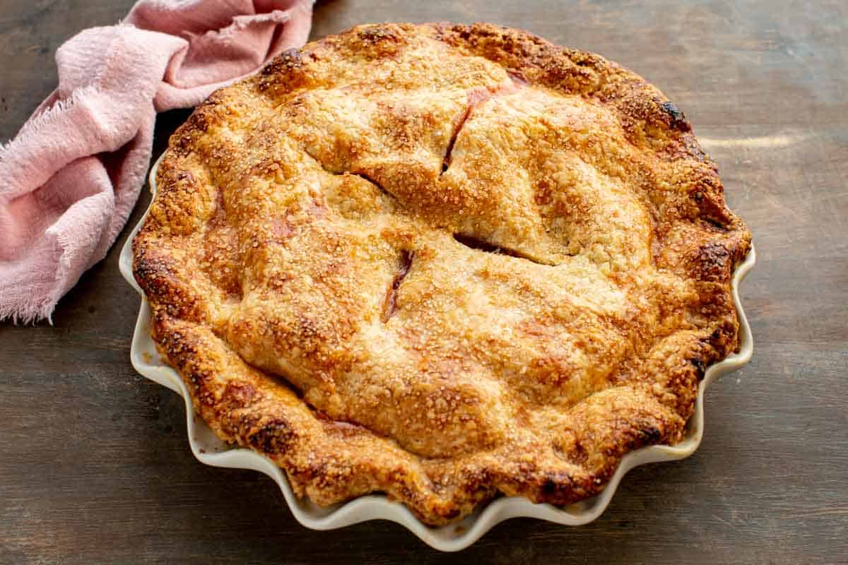 A freshly baked pie with caramelized sugar on the crust.