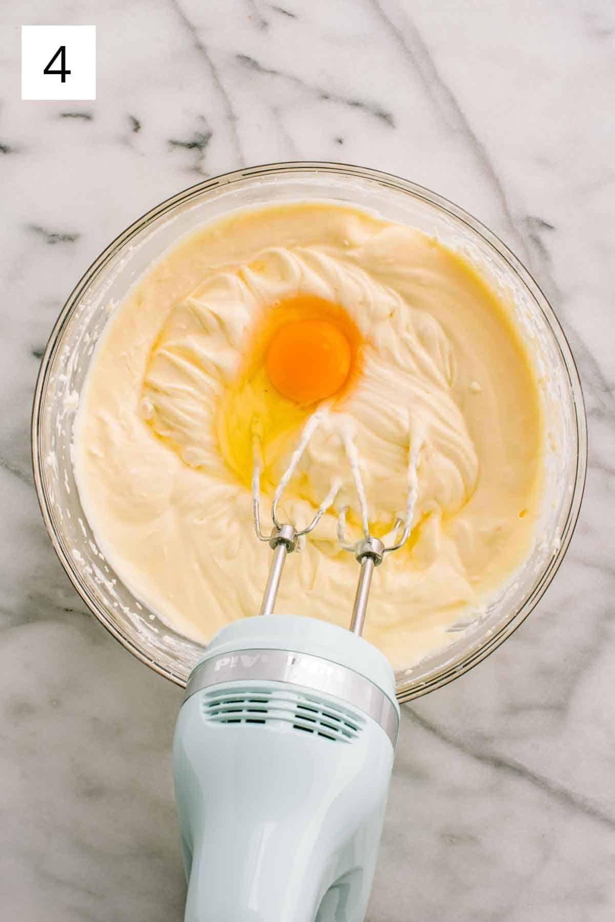 Adding eggs to recipe, one at a time.