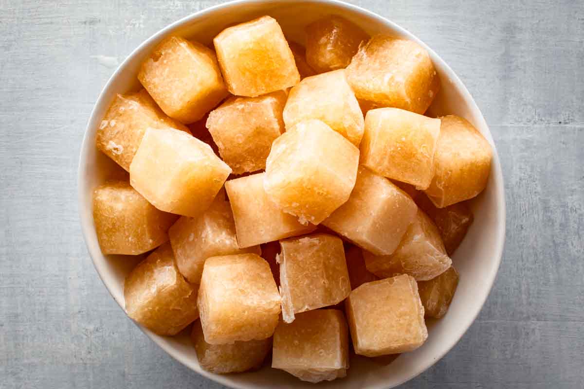 A bowl filled with turkey stock ice cubes.