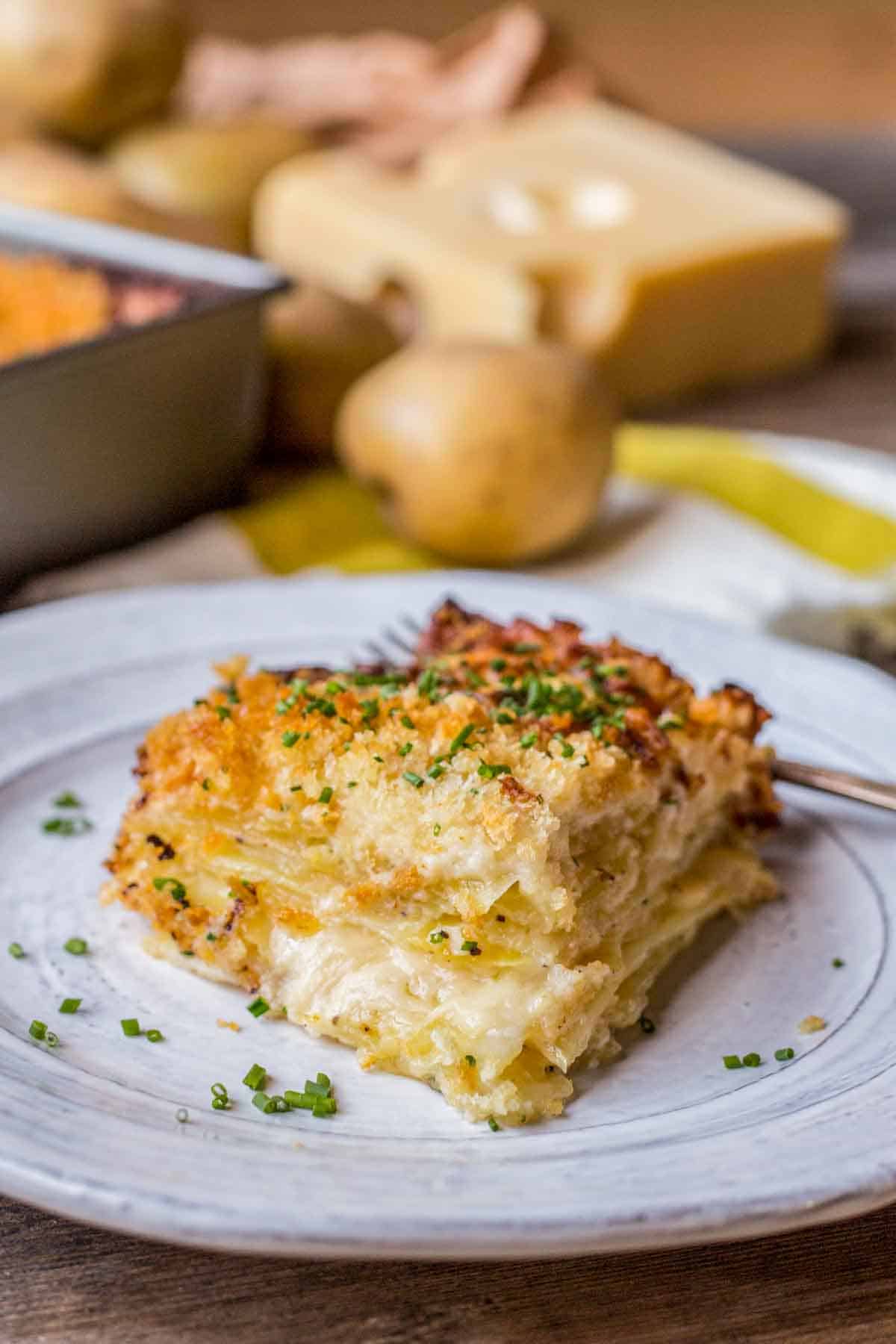 A slice of Dauphinoise potato gratin on a gray plate.
