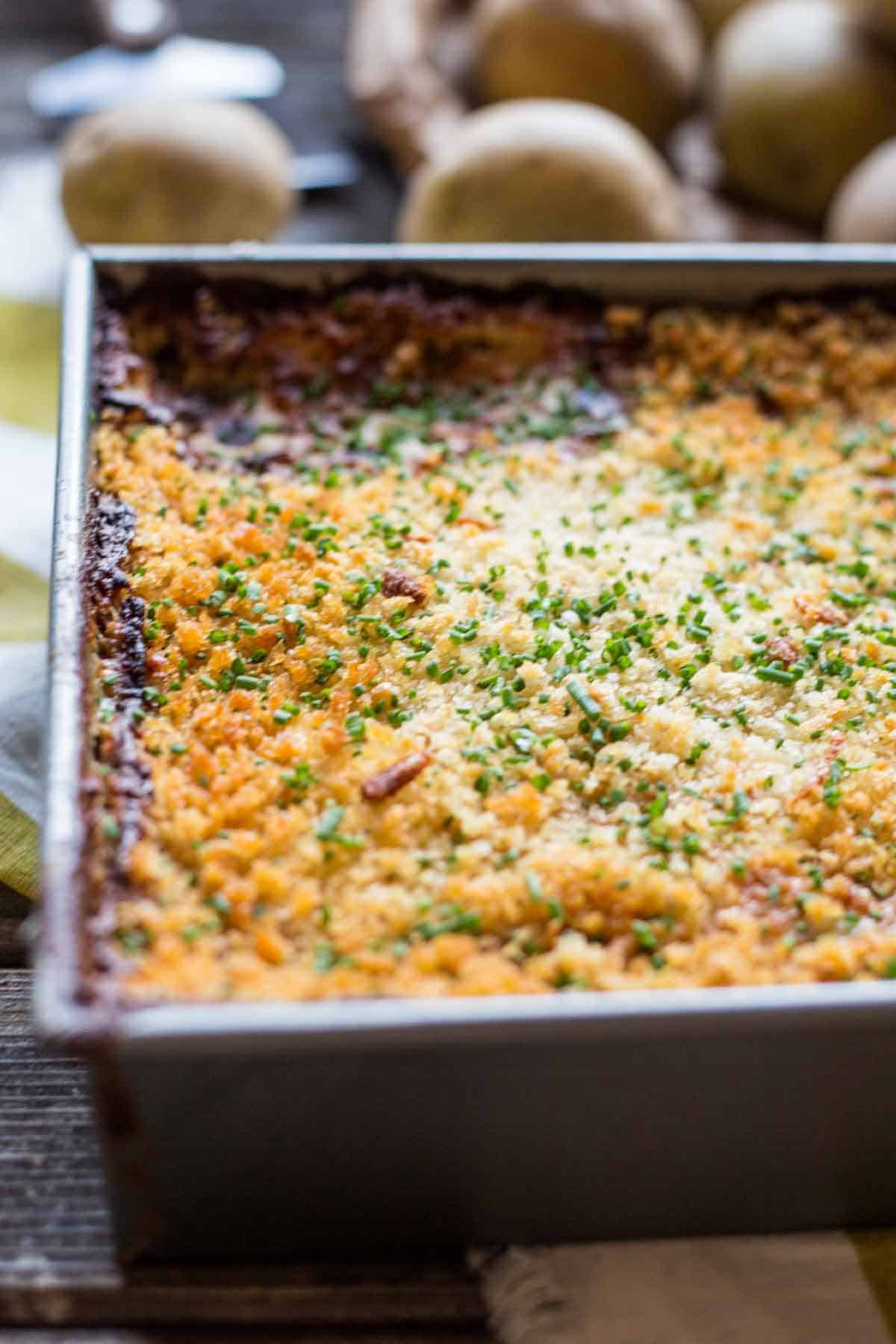 Potato gratin in a baking dish with a golden, crispy top.