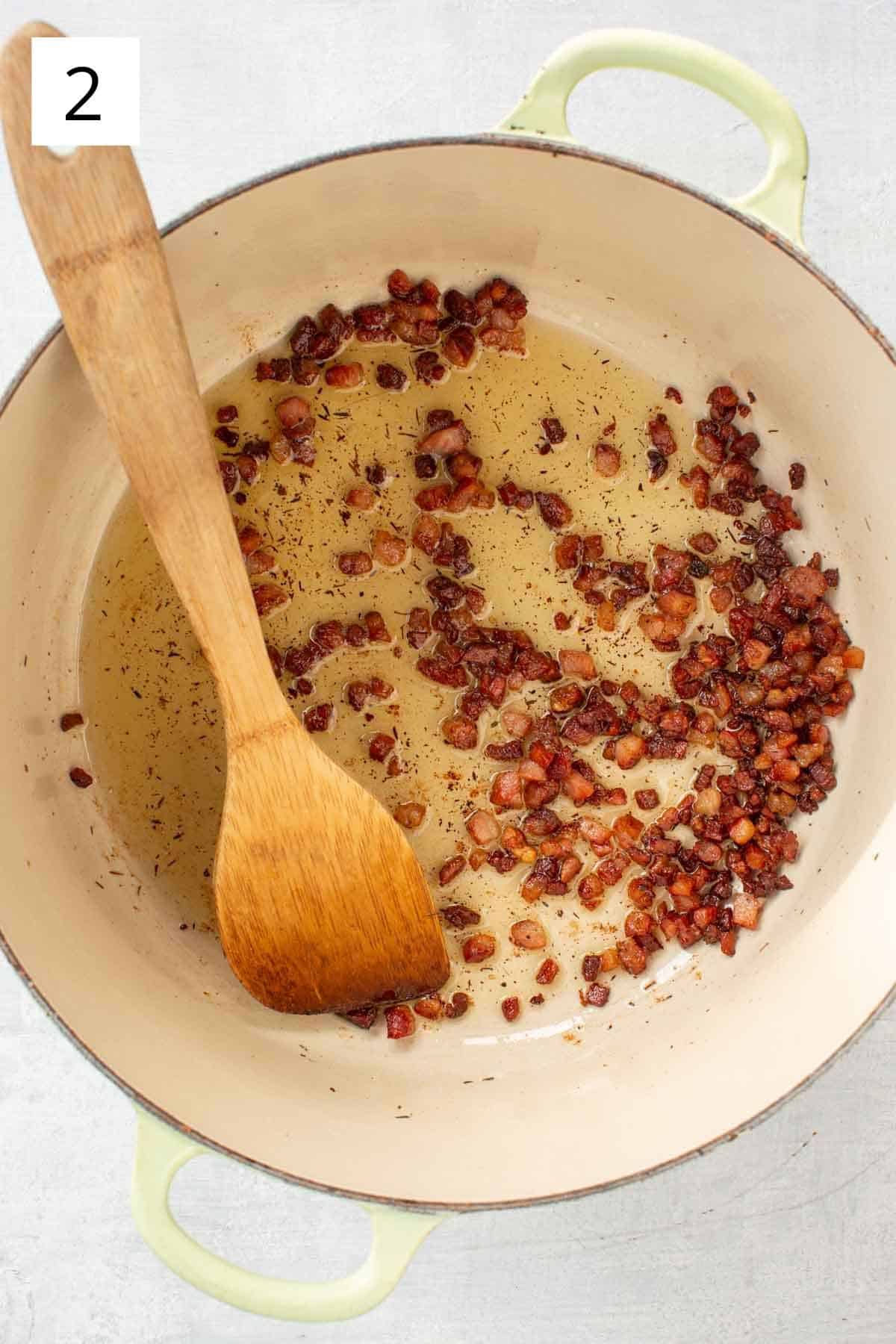 Cooking pancetta in oil.