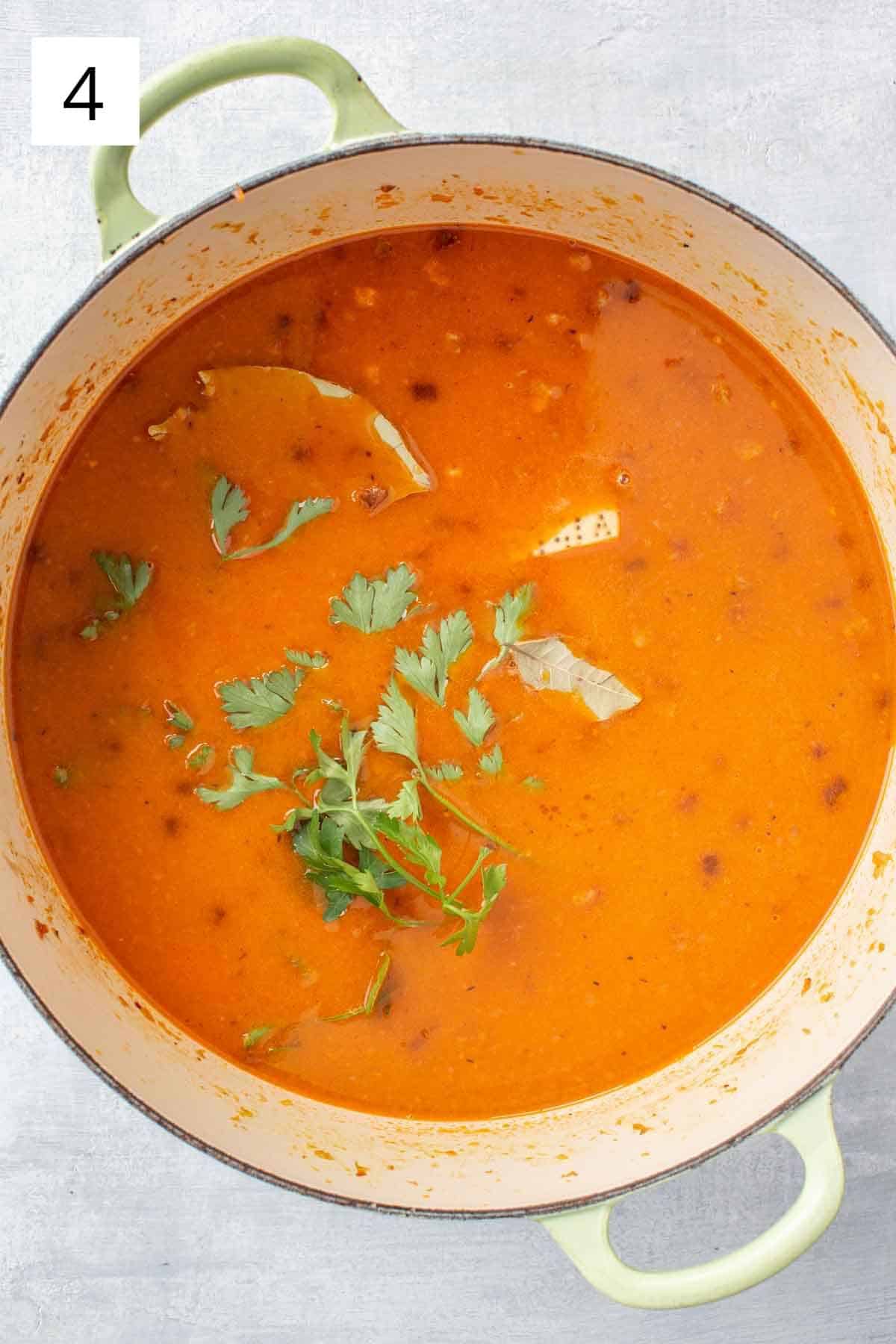 Making pasta fazool in a large pot.