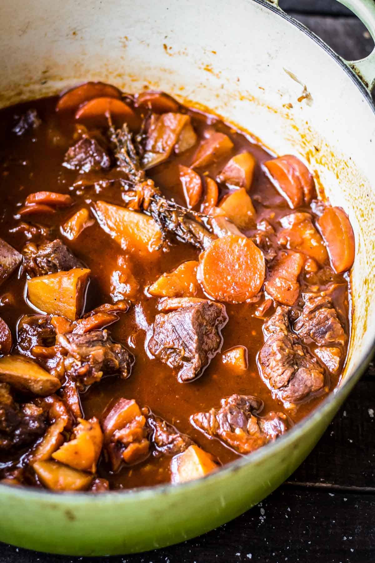 Beef and carrot Irish stew in a cast iron Dutch oven.
