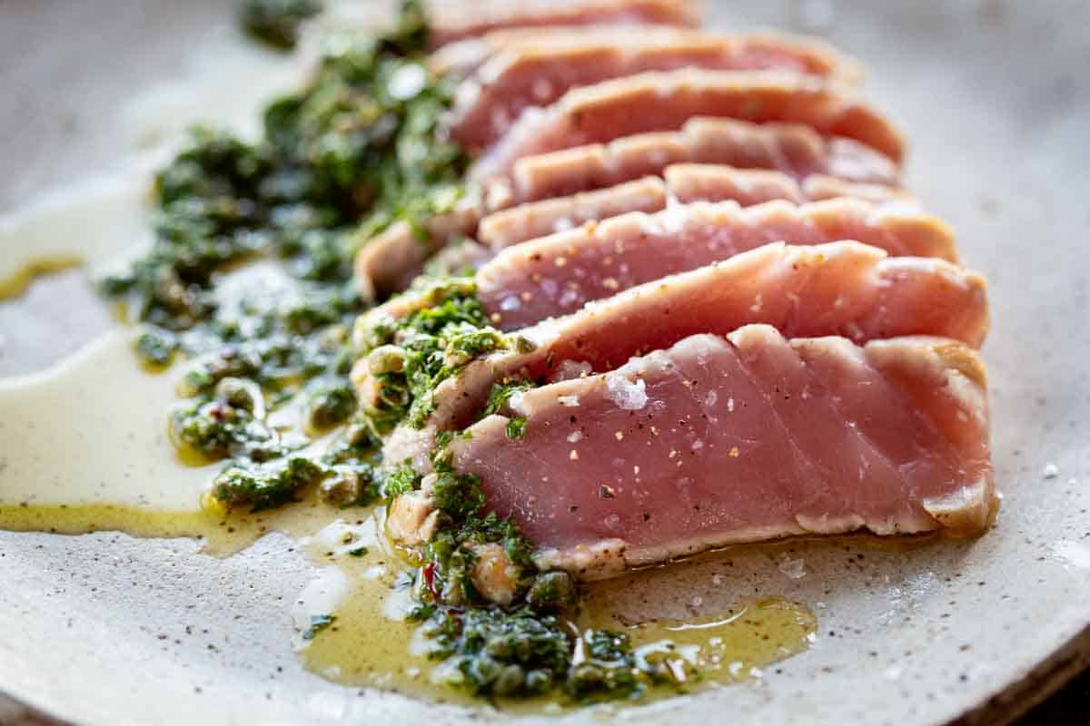Sliced, rare seared tuna with Italian salsa verde.