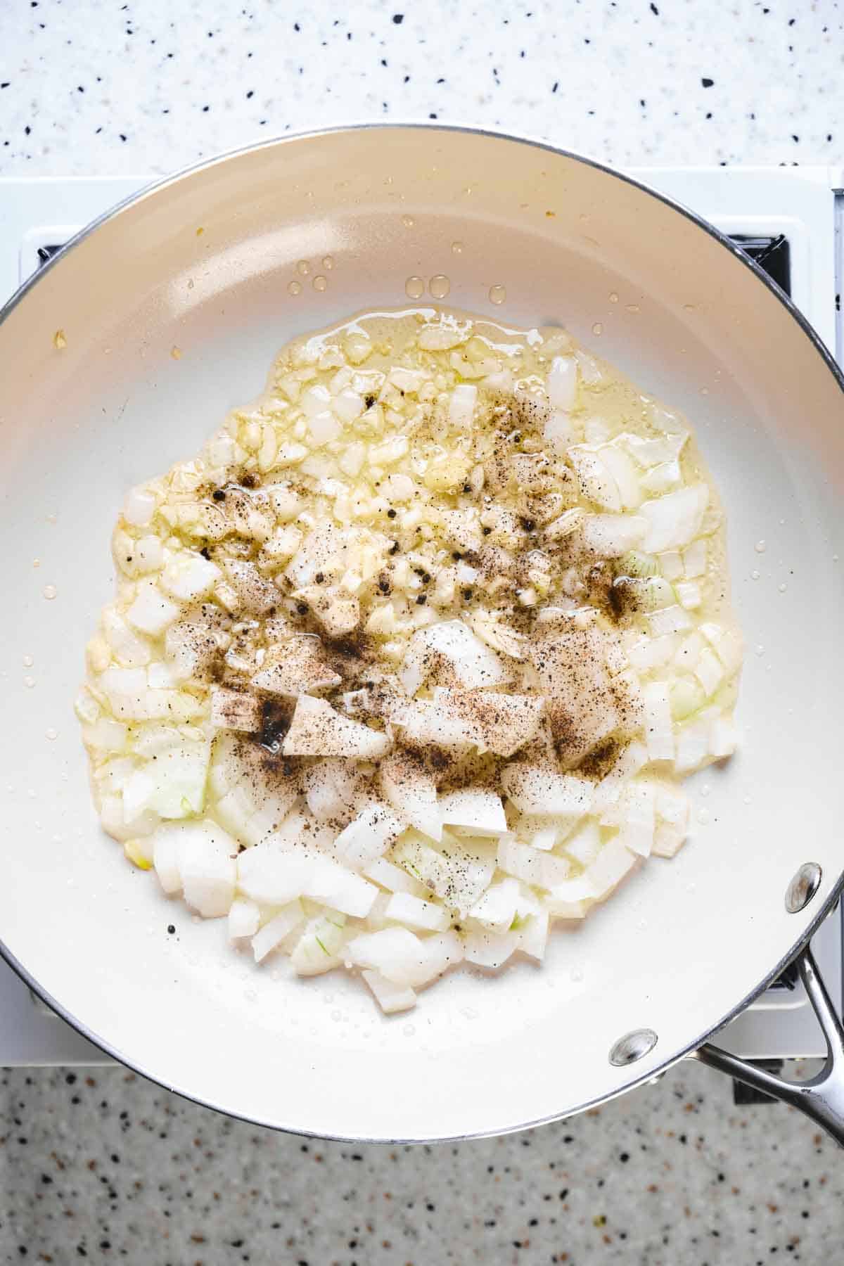 Onions sautéing with seasonings. 
