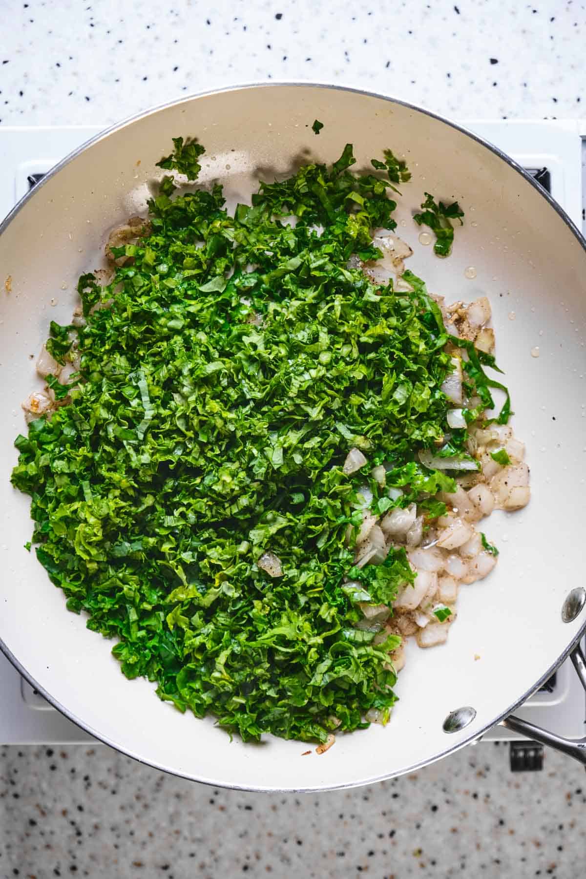 Sautéing kale with onions.