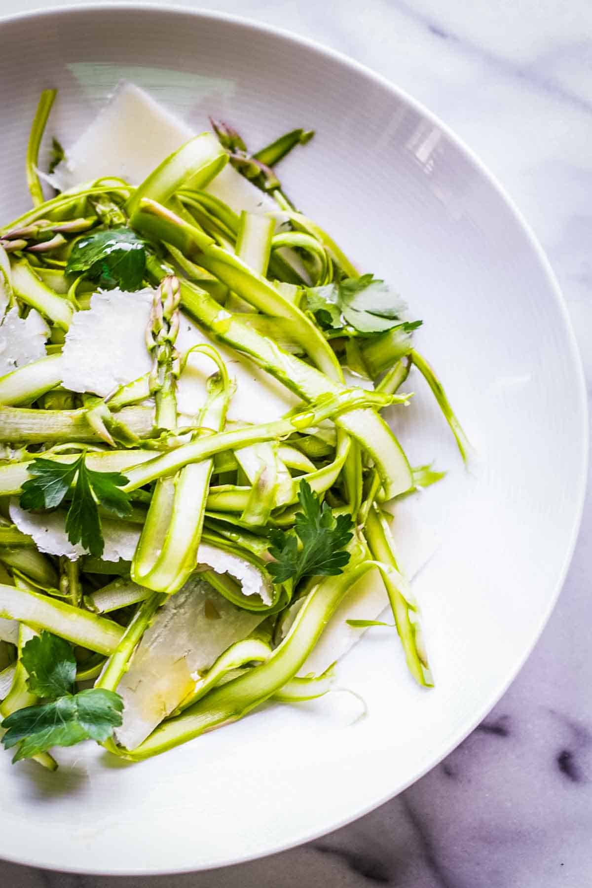 Thinly shaved ribbons of asparagus tossed with Pecorino Romano cheese and parsley.