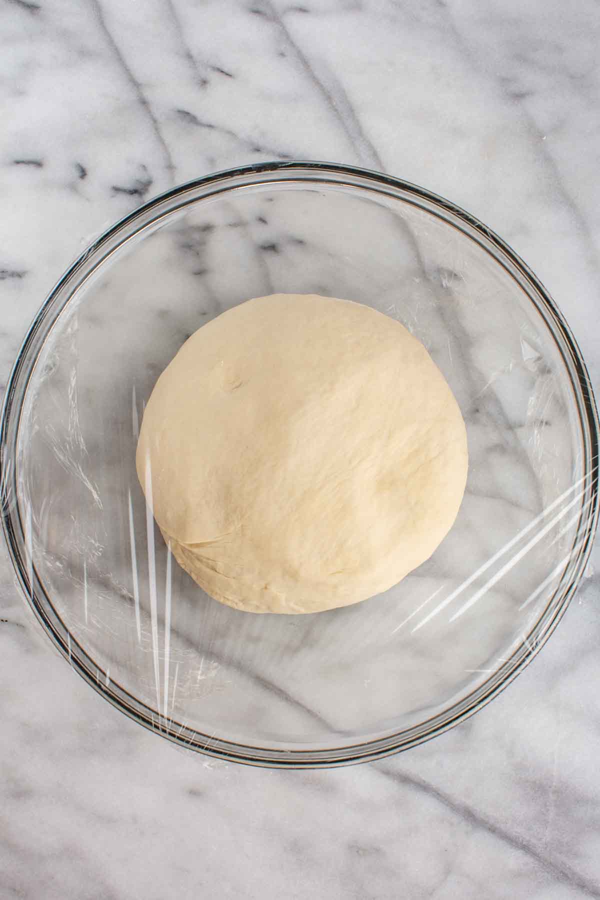 A ball of dough in a bowl.