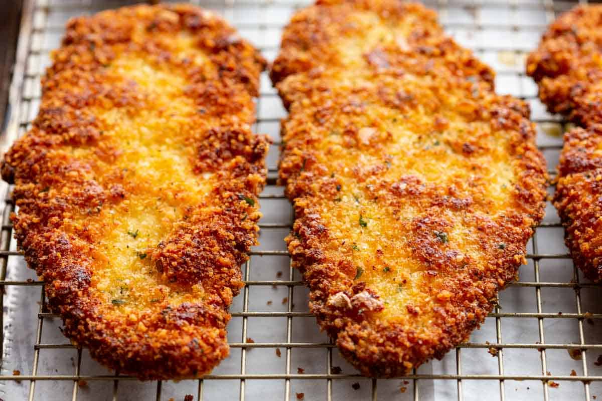 The crispy breading of an Italian breaded chicken cutlet.