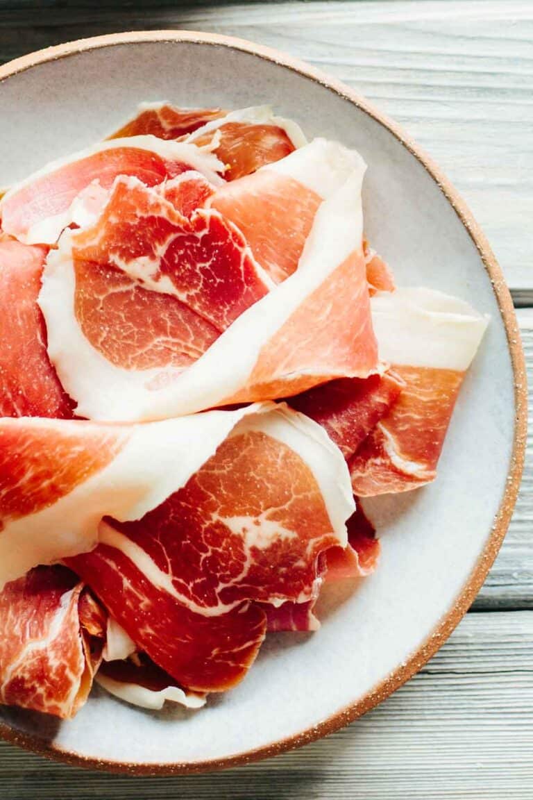 A plate of sliced prosciutto.