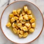 A plate of brown butter sage potato gnocchi.