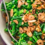 Sautéed broccoli raab with crispy garlic chips on top.