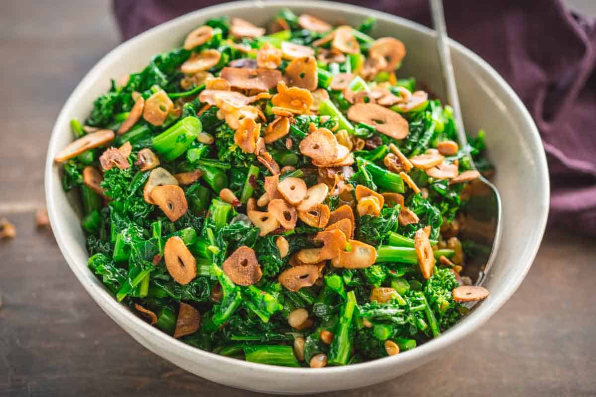 A bowl of Sicilian rapini in a bowl with a spoon.
