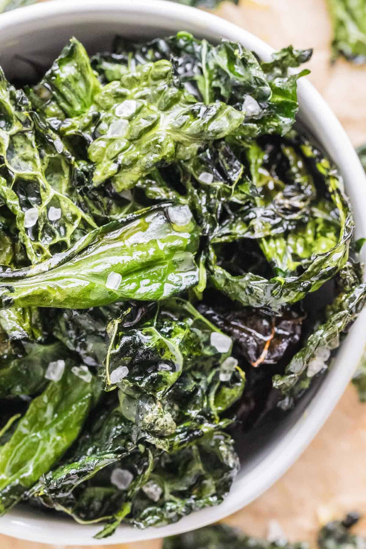 A close up of bright green kale with sea salt.