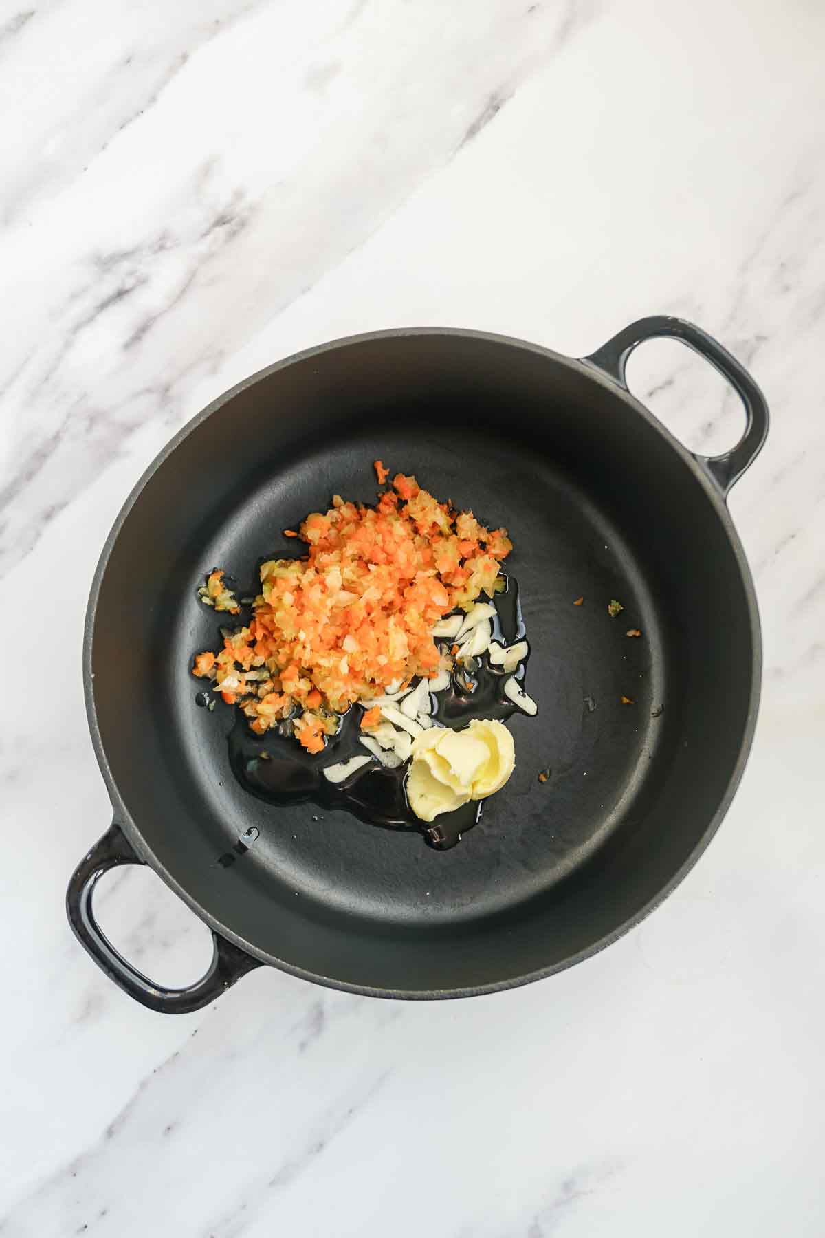 Sautéing vegetables in butter and olive oil.