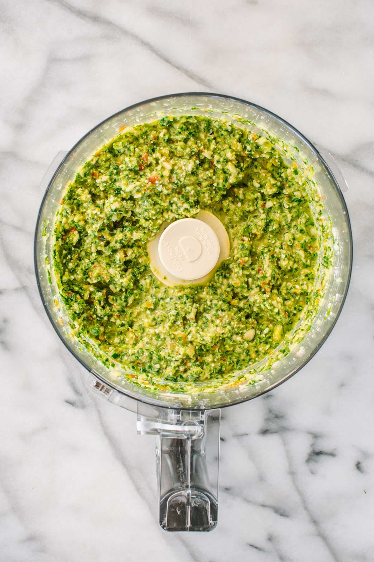 Freshly blended pesto alla Trapanese in a food processor.